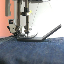 Load image into Gallery viewer, Sewing machine needle threaded with blue fabric
