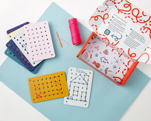 Load image into Gallery viewer, Colorful pegboard cards with a box on a light blue surface
