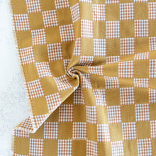 Load image into Gallery viewer, Checkered fabric with a mix of yellow and red patterns on a white background