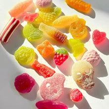 Load image into Gallery viewer, Assorted colorful gummy candies on a white surface