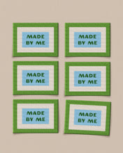 Load image into Gallery viewer, Six framed pictures with 'MADE BY ME' text on a beige wall.