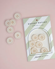 Load image into Gallery viewer, Set of white buttons with a 'Matchy Matchy Sewing Club' packaging on a pink background