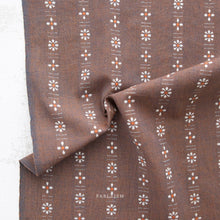 Load image into Gallery viewer, Brown fabric with floral pattern and 'Pableism' branding on a light background