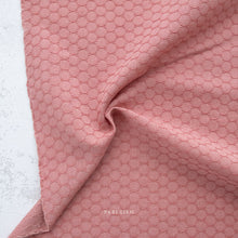 Load image into Gallery viewer, Pink textured fabric with a subtle pattern on a light gray background