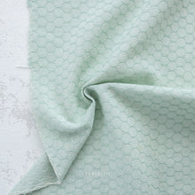 Load image into Gallery viewer, Textured light green fabric on a white background