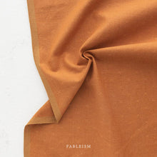 Load image into Gallery viewer, Brown fabric with a subtle pattern on a white background, featuring the brand 'Fableism'.