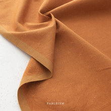 Load image into Gallery viewer, Brown fabric with subtle pattern on a white background, featuring the brand 'Fableism'.