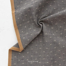 Load image into Gallery viewer, Gray fabric with a subtle pattern and brown border, featuring the brand 'Fableism'.
