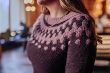 Load image into Gallery viewer, Person wearing a patterned sweater with a blurred background