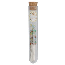 Load image into Gallery viewer, A clear glass tube with a cork stopper, containing several silver patchwork pins with small multicolored beads, and a round gold label reading 'Yarn Yarn'.