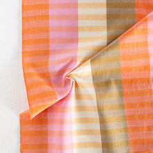 Load image into Gallery viewer, Fabric with orange, pink, and beige plaid pattern on a light background