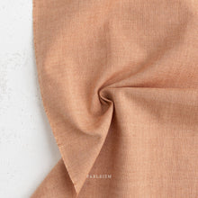 Load image into Gallery viewer, Close-up of brown fabric with 'Fableism' branding on a white background