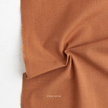 Load image into Gallery viewer, Brown fabric with 'Fableism' branding on a white background