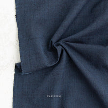 Load image into Gallery viewer, Close-up of dark blue fabric with 'Fableism' branding on a white background
