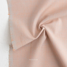 Load image into Gallery viewer, Close-up of beige fabric with 'Fable' branding on a white background